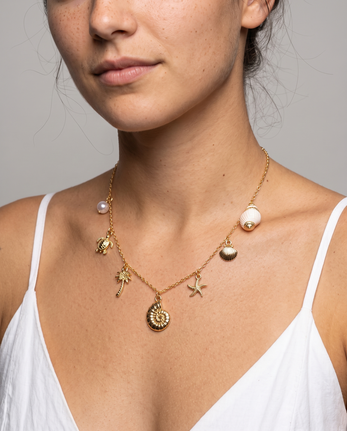 Marina Pearl Necklace in gold finish worn close-up - ARWELY detail on the body