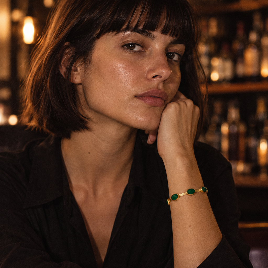 Cléo Bracelet worn, close view of the green stones against the skin