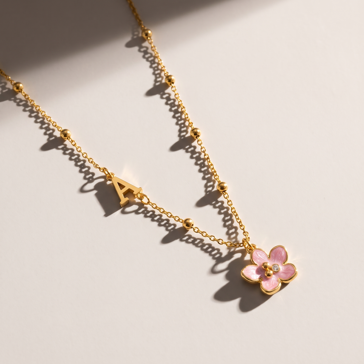 Amelie Initial Necklace - ARWELY editorial still life with a hard shadow