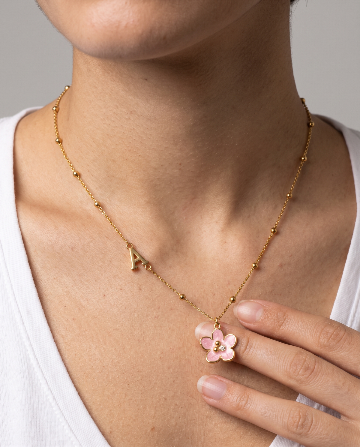 Amelie Initial Necklace worn close-up - ARWELY detail on the body