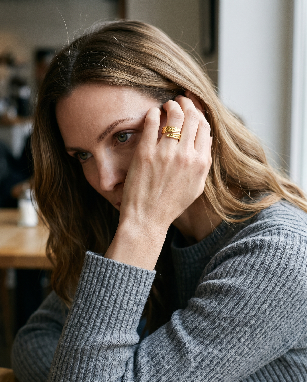 Bold Band Ring in gold finish worn by a model - ARWELY daylight lifestyle photo