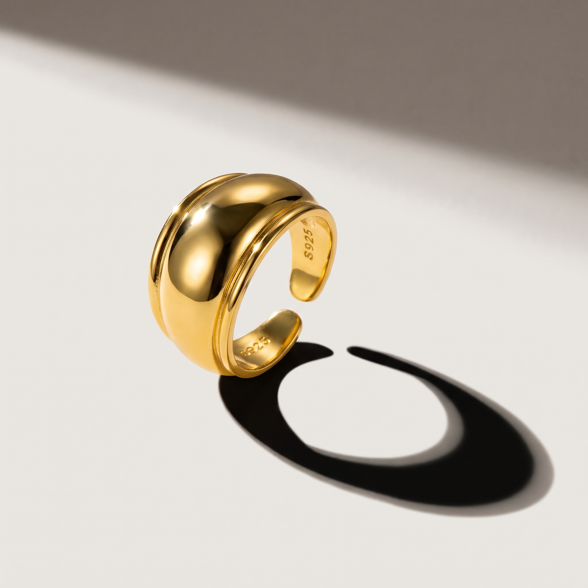 Edge Open Ring in gold finish - ARWELY editorial still life with a hard shadow