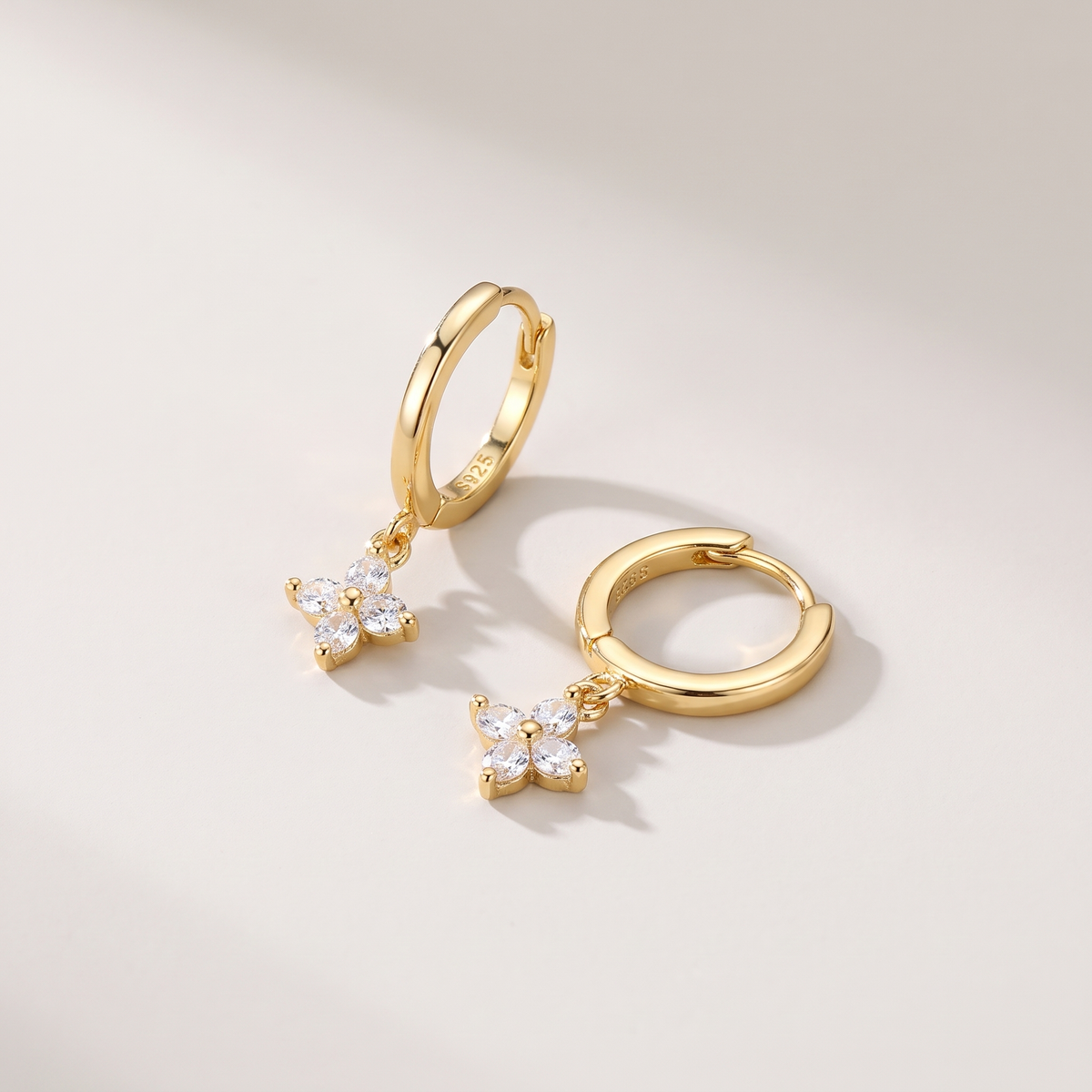 Lucky Clover Earrings in gold finish - ARWELY, full view on a grey studio background