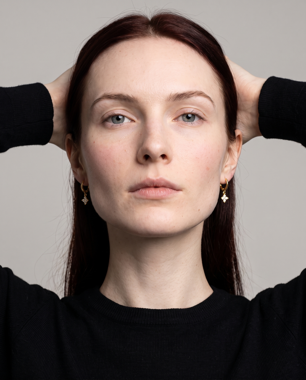 Lucky Clover Earrings in gold finish worn by a model - ARWELY studio portrait