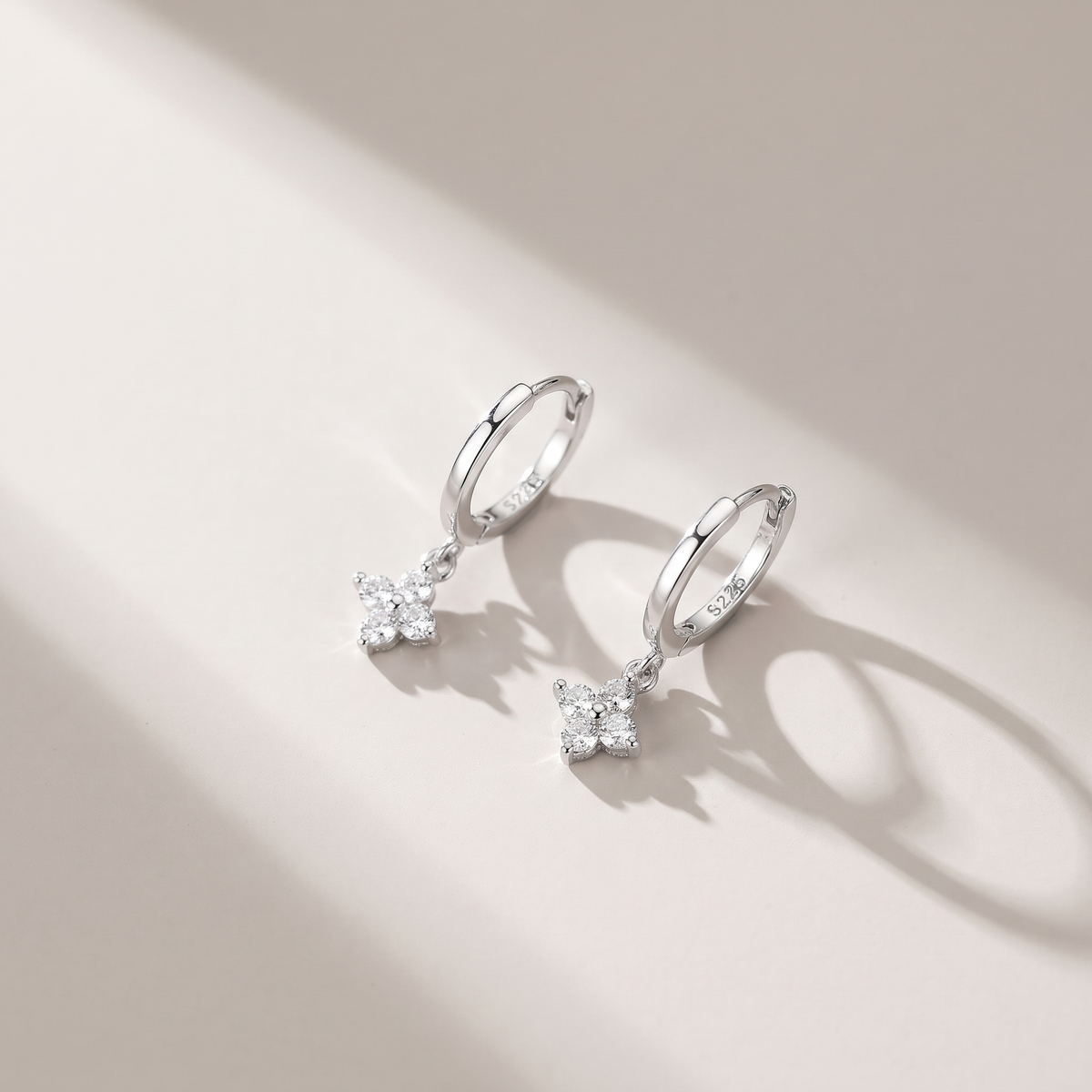 Lucky Clover Earrings in gold finish - ARWELY editorial still life with a hard shadow
