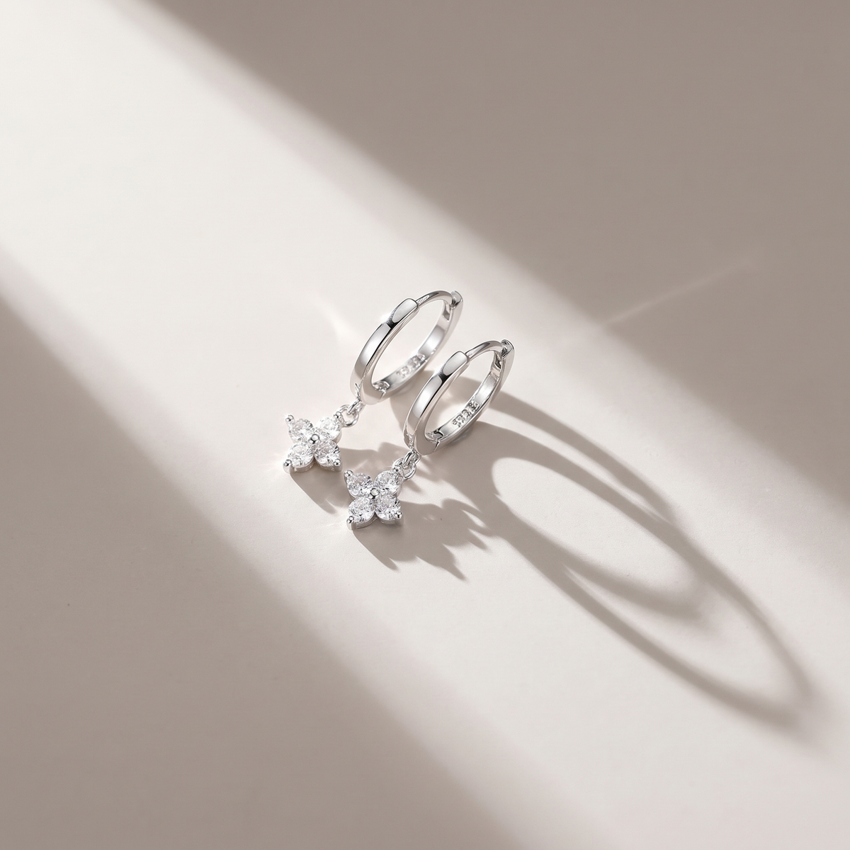 Lucky Clover Earrings in silver finish - ARWELY editorial still life with a hard shadow