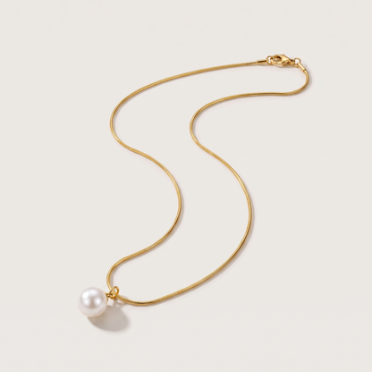 Luna Pearl Necklace in gold finish - ARWELY, full view on a grey studio background