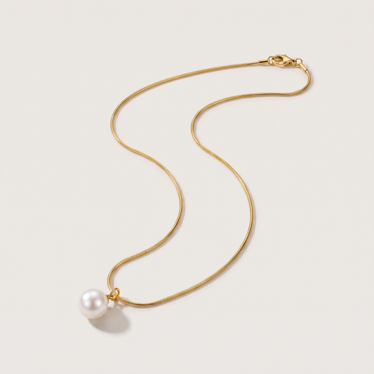 Luna Pearl Necklace in gold finish - ARWELY, full view on a grey studio background