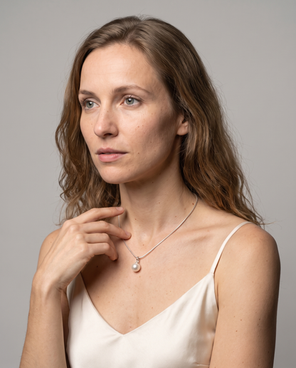 Luna Pearl Necklace in silver finish worn by a model - ARWELY studio portrait