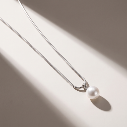Luna Pearl Necklace in silver finish - ARWELY editorial still life with a hard shadow