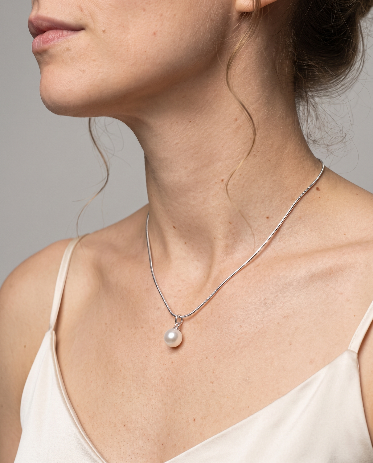 Luna Pearl Necklace in silver finish worn close-up - ARWELY detail on the body