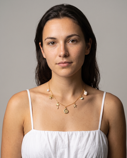 Marina Pearl Necklace in gold finish worn by a model - ARWELY studio portrait