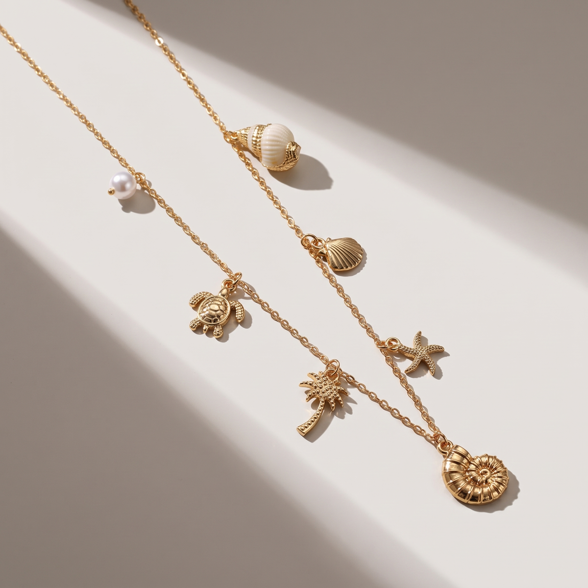 Marina Pearl Necklace in gold finish - ARWELY editorial still life with a hard shadow