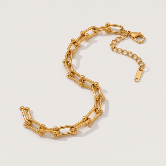 Vera Paperclip Bracelet in gold finish - ARWELY, full view on a grey studio background