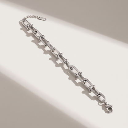Vera Paperclip Bracelet in silver finish - ARWELY editorial still life with a hard shadow