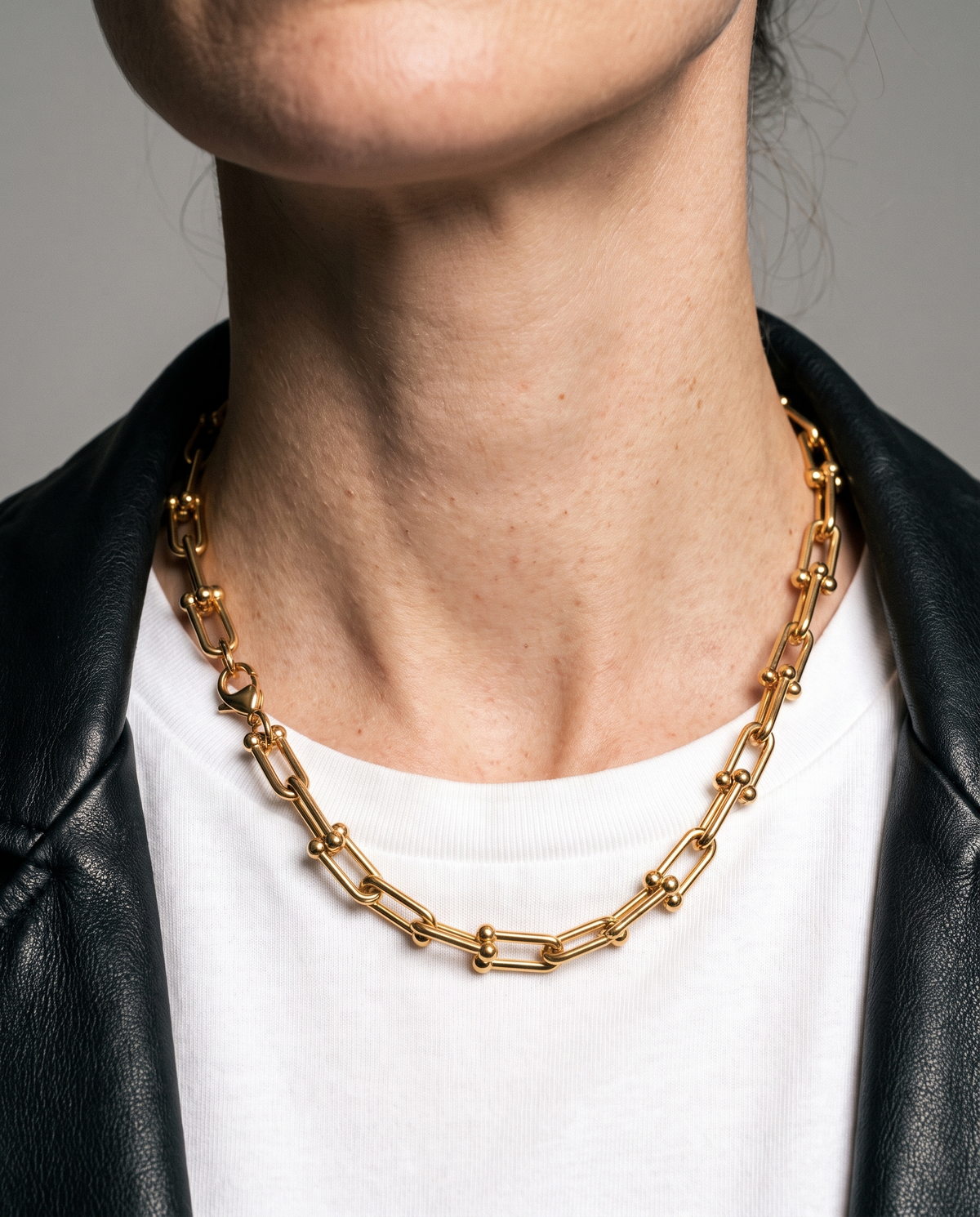 Vera Paperclip Necklace in gold finish worn close-up - ARWELY detail on the body