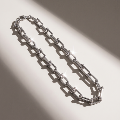 Vera Paperclip Necklace in silver finish - ARWELY editorial still life with a hard shadow