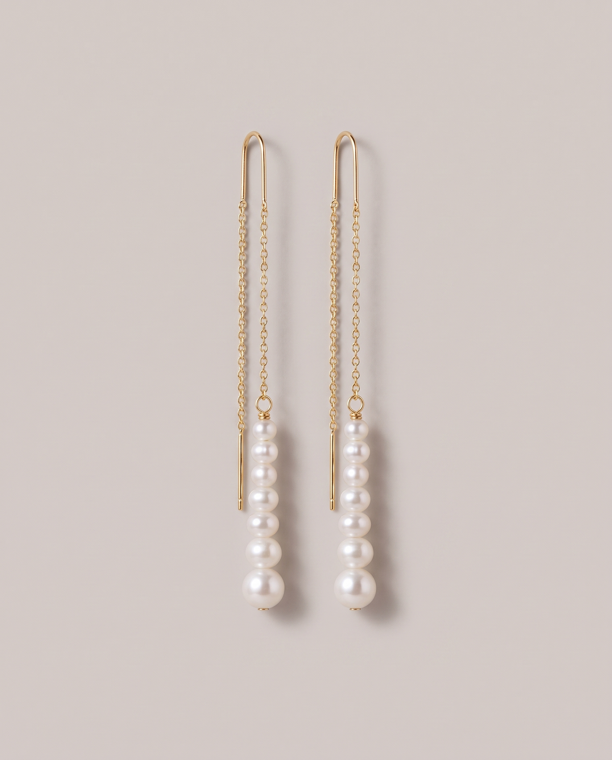 Cascade Pearl Threaders in gold - ARWELY, the pair hanging at full length
