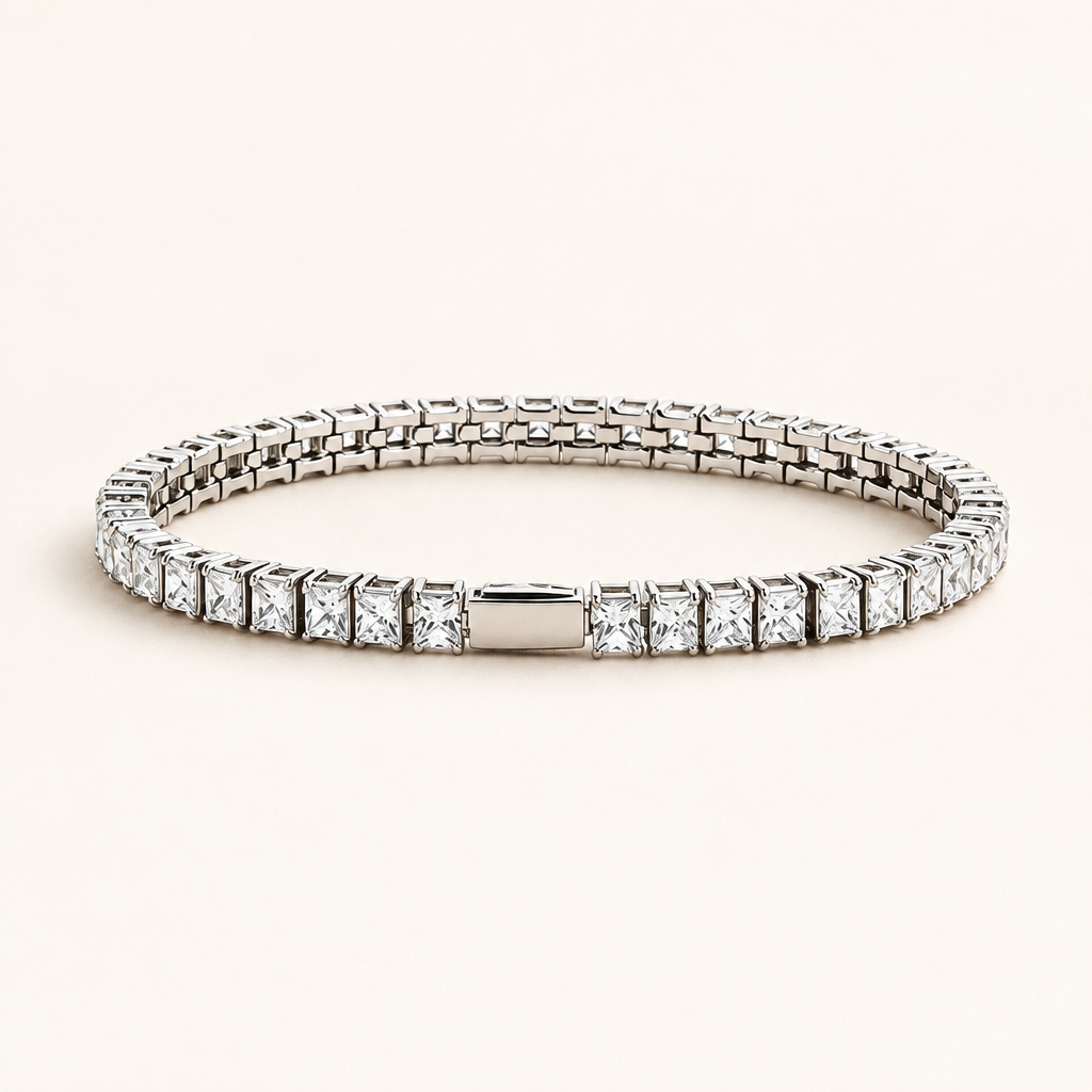 Rivière Tennis Bracelet in gold, square-cut zirconia set in a continuous line, on a warm off-white background