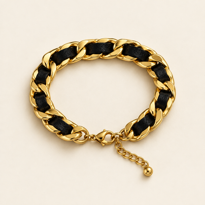 Tandem Leather Bracelet, a gold chain with a leather panel, on a warm off-white background