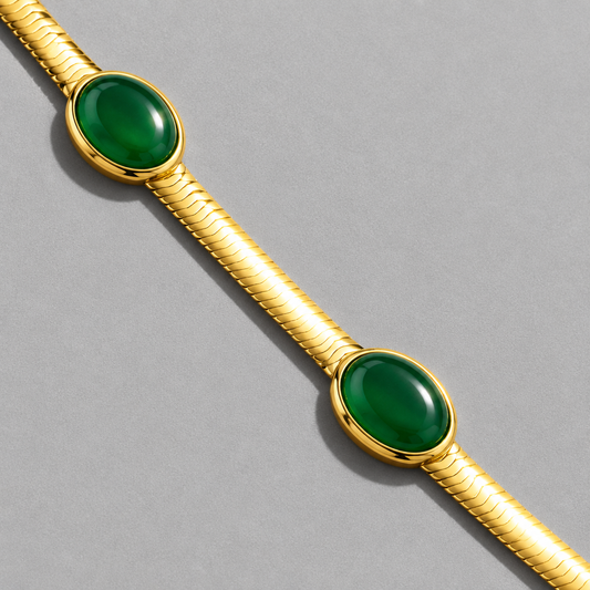 Cléo Bracelet detail of the oval green cabochons in plain gold bezels