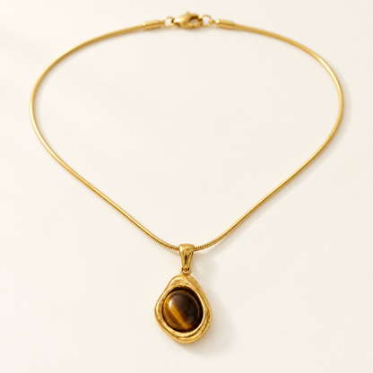 Galet Pendant Necklace — tiger's eye in an uneven gold bezel on a snake chain