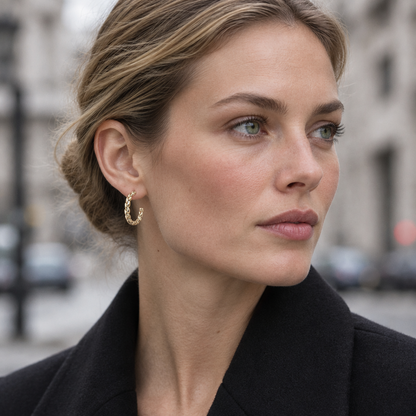 Arc Hoop Earrings worn on a city street in overcast daylight