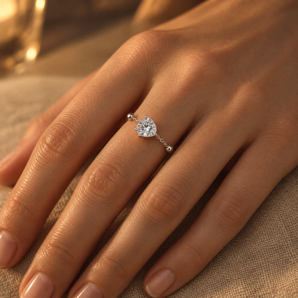 Rosée Drop Ring in silver worn on the hand in evening light