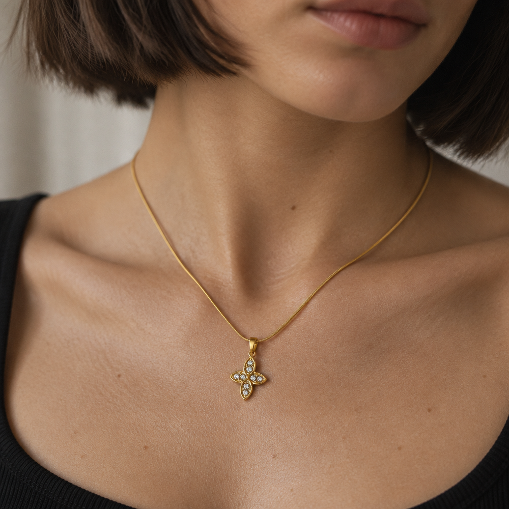 Trèfle Pendant Necklace worn at the collarbone in window light